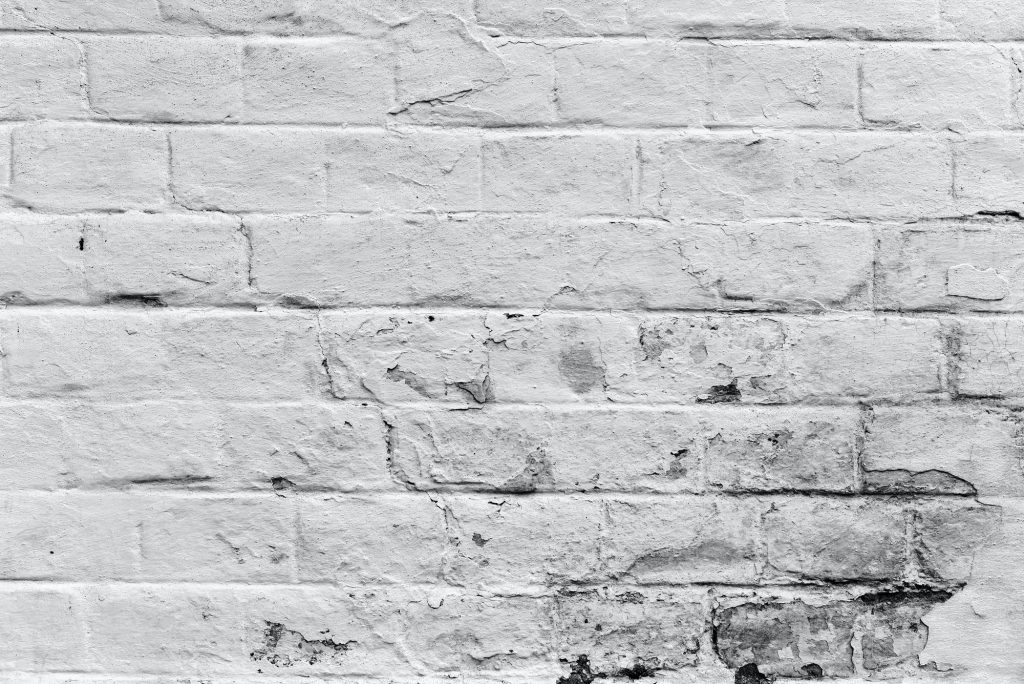 Old weathered white brick wall texture